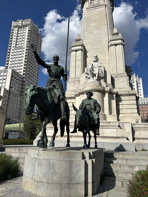 Sculptural group in Plaza de España, Madrid, dedicated to The Ingenious Gentleman Don Quijote of La Mancha. In the foreground, Don Quijote and Sancho Panza on their mounts. Behind them, Miguel de Cervantes with the symbolic book in his hand.