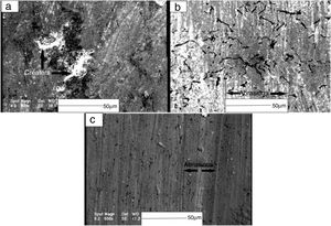 SEM secondary electron images of the worn surfaces for WC/FeAl-B at room temperature (a) 0, (b) 500 and (c) 1000ppm B.