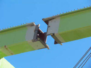 Detail of node-upper chord connection with staggered welds.