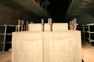 Upper part of the fraction of pier built in situ. You can see the 50mm diameter vertically protruding bars placed prior to the operation for mounting the upper prefabricated piece. Compression nuts on the corner bars and bearing pads are placed below the couplers. Only stress bar couplers were placed on the remaining bars.