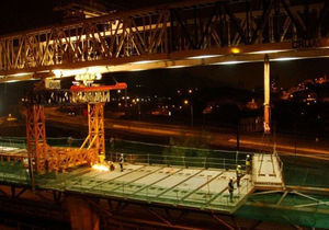 Mounting the prefabricated slabs with the launching gantry.
