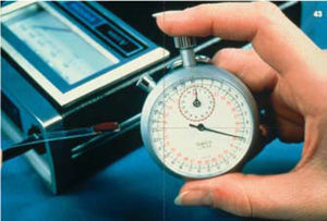 Portable battery-operated reflectance meter, in conjunction with rapid enzyme test strip-based quantitative method for estimating capillary blood glucose.