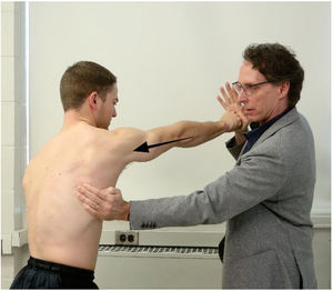 Muscle test for the serratus anterior (scapular protraction test). The examiner resists maximal-effort protraction of the scapula and the entire upper extremity.