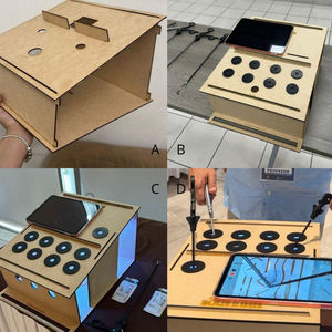Development progress of the low-cost laparoscopic simulator. (A) First prototype. (B) Simulator during the initial testing phase. (C–D) Improved version of the simulator incorporating modifications and expert recommendations.
