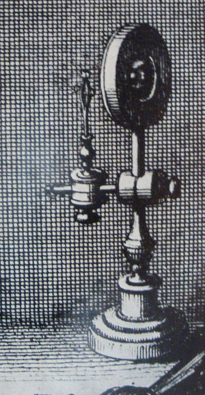 Beautiful rendering of a primitive single-lens microscope. This detail, from an engraving by the Valencian microscopist Crisóstomo Martínez, dates from the second half of the 17th century.