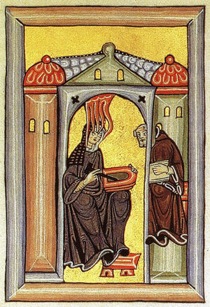 Hildegard of Bingen, under divine inspiration, dictating to the monk Volmar. Illumination in her book Scivias.