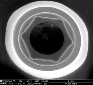 SEM photograph of the top of the externally hexed Ti abutment, with 45× magnification.