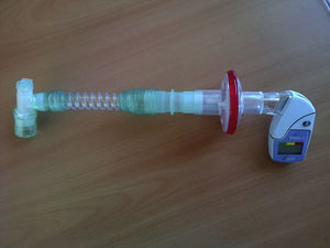 Set-up of an electronic peak flow meter (PiKo I) for measuring cough PEF through the tracheal cannula.