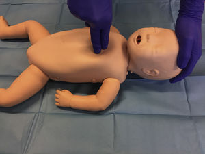 Chest compression technique using two fingers.