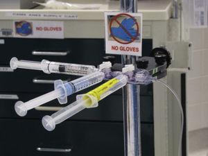 Medication manifold secured in the clean zone of the anesthesia workspace.