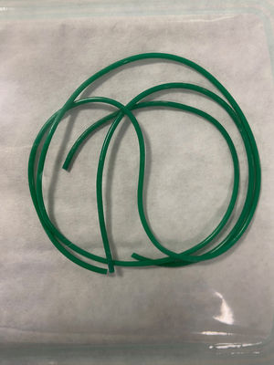 Foreign body removed by means of cystoscopy. Plastic, tubular, hollow foreign body measuring 75 cm in length with a knot in the middle. The image shows the foreign body, cut at the site of the simple knot, after surgical removal.