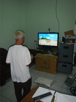 A patient training with the Wii Fit balance in the exercise room allowing only individual activities.
